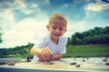 Little boy clever child playing checkers in park Royalty Free Stock Photo