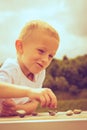 Little boy clever child playing checkers in park Royalty Free Stock Photo