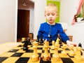 Little boy clever child playing chess thinking, Royalty Free Stock Photo