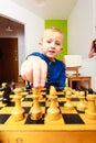 Little boy clever child playing chess thinking, Royalty Free Stock Photo