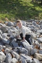 Boy climbing on rocks Royalty Free Stock Photo