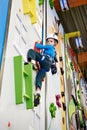 Little boy is climbing in child sport park on wall Royalty Free Stock Photo