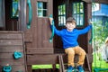 Little boy climbing ladder on slide at playground. Child is 5 7 Royalty Free Stock Photo