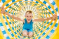 Little boy climbing the maze in children trampoline club. Excited kid having fun at game center Royalty Free Stock Photo