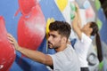 little boy climbing rock wall indoor Royalty Free Stock Photo