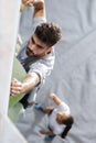 little boy climbing rock wall indoor Royalty Free Stock Photo