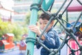 Little boy climbing on the rope at playground outdoor Royalty Free Stock Photo