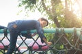 Little boy climbing on the rope at playground outdoor Royalty Free Stock Photo