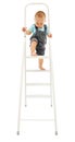 Little boy climbing up on ladder