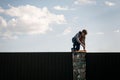 A little boy climbs over the fence Royalty Free Stock Photo