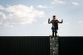 A little boy climbs over the fence Royalty Free Stock Photo