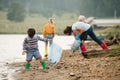 Little boy collecting garbage with group of kids Royalty Free Stock Photo