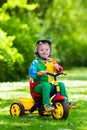 Little boy on colorful tricycle Royalty Free Stock Photo