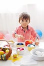 Little boy, coloring eggs for Easter at home Royalty Free Stock Photo