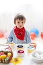 Little boy, coloring eggs for Easter at home Royalty Free Stock Photo