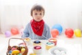 Little boy, coloring eggs for Easter Royalty Free Stock Photo