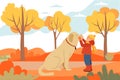 A little boy and a companion with a big fluffy brown dog. Walking along the autumn street, forest Royalty Free Stock Photo