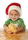 Little boy cooking the Christmas cake Royalty Free Stock Photo