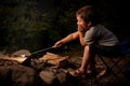 Boy cooking marshmallow Royalty Free Stock Photo