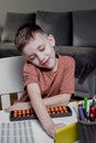 Little boy counting with the help of mental arithmetic. Mathematics in pleasure Royalty Free Stock Photo