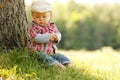 Little boy in a cowboy hat playing on nature Royalty Free Stock Photo