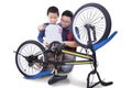 Little boy and dad fixing bicycle Royalty Free Stock Photo