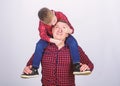Little boy with dad man. father and son in red checkered shirt. childhood. parenting. fathers day. happy family. Fits Royalty Free Stock Photo