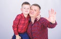 Little boy with dad man. father and son in red checkered shirt. fathers day. happy family. childhood. parenting. Smiling Royalty Free Stock Photo