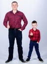 Little boy with dad man. fathers day. happy family. childhood. parenting. father and son in red checkered shirt. Country Royalty Free Stock Photo