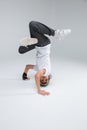 A little boy dancer break dance, stands on his head. Royalty Free Stock Photo