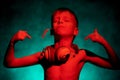 A little boy dances to the music with a spikelet and headphones. Royalty Free Stock Photo