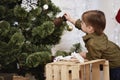 Little boy decorating Christmas tree Royalty Free Stock Photo