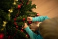 Little boy decorating Christmas tree Royalty Free Stock Photo