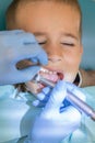 A little boy at a dentist's reception in a dental clinic. Children's dentistry, Pediatric Dentistry. A female stomatologist is