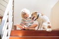 Little boy and dog on stairs