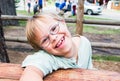 Little Boy With Downs-Syndrome Sitting at Table