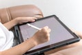 Little boy Drawing Digital Picture On Electronic Touch Tablet With Stylus Pen Royalty Free Stock Photo