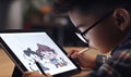 Little boy is drawing and paint characters on a digital tablet with pencil.