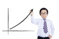 Little boy drawing statistic arrow Royalty Free Stock Photo