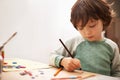 Little boy, drawing and writing with pencil for art, craft or color in learning creativity or education at home. Young Royalty Free Stock Photo