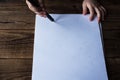 Little boy draws on white paper with colored pencils Royalty Free Stock Photo