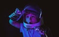 A little boy dreams of becoming an astronaut and flying into space. Cosmos childrens in spacesuit and helmet dreams