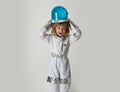 A little boy dreams of becoming an astronaut and flying into space. Cosmos childrens in spacesuit and helmet dreams Royalty Free Stock Photo