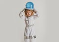 A little boy dreams of becoming an astronaut and flying into space. Cosmos childrens in spacesuit and helmet dreams Royalty Free Stock Photo