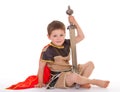 Little boy dressed as a knight.