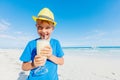 Little boy drinking cocktail on tropical beach Royalty Free Stock Photo