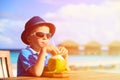 Little boy drinking coconut cocktail on tropical Royalty Free Stock Photo