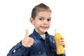 Little boy is drinking fresh orange juice on white background Royalty Free Stock Photo