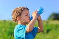 Little boy drinking gas water Royalty Free Stock Photo