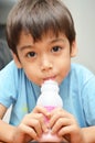 Little boy drinking milk strawberry favour